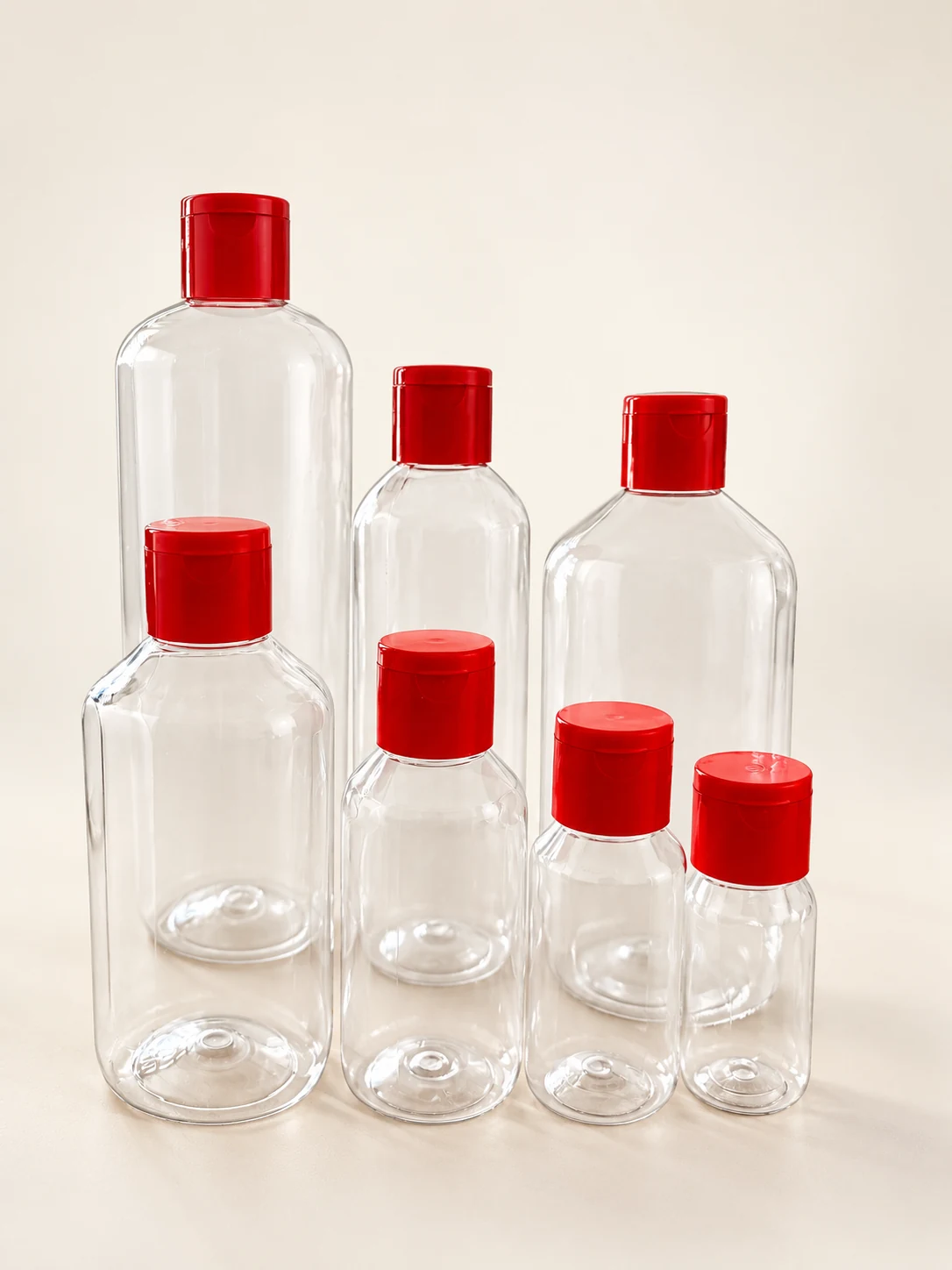 Hornplast clear plastic bottles in seven sizes with red caps